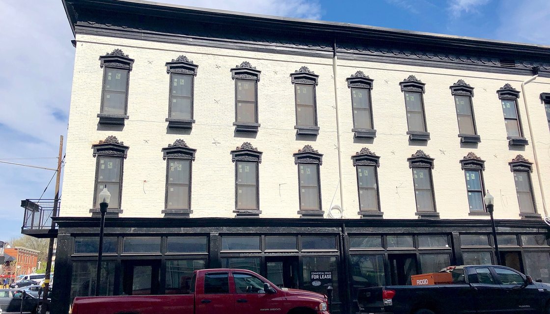 Brick rowhouses along a Covington street